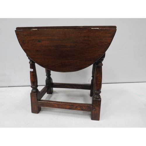 839 - Small antique Oak drop leaf table with swivel top, 47cm high, the top measures 63cm by 47cm when ope... 