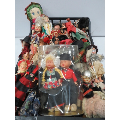 840 - Large selection of various vintage souvenir dolls.