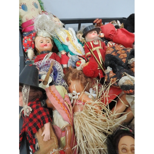 840 - Large selection of various vintage souvenir dolls.