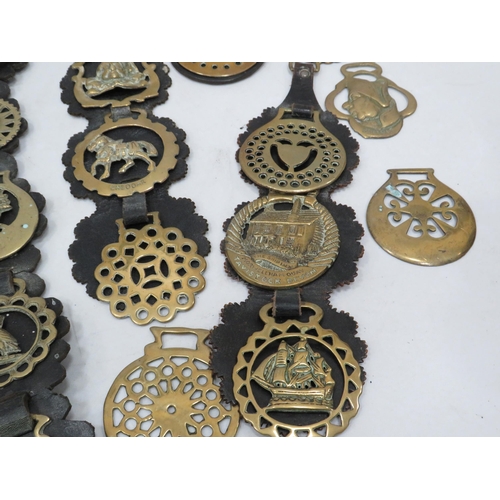 841 - 35 vintage horse brasses some with leathers.