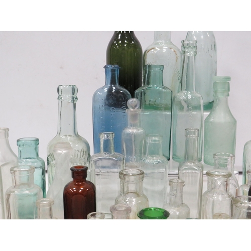 852 - Selection of vintage glass bottles including Advertising and Medical.