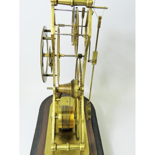 35 - Brass Skeleton Clock with enamelled metal dial. Appears to be complete and in running order.  No Mak... 