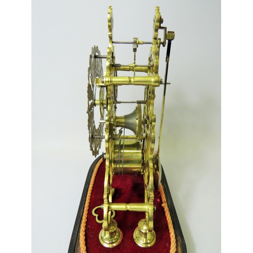 36 - Brass Skeleton clock with wooden base and glass dome cover. No makers mark visable. Comes with key a... 