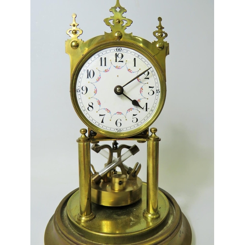 38 - Brass based Anniversary clock under Glass Dome.  Appears to be in running order but no key present. ... 