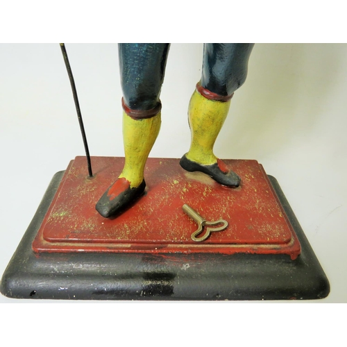 42 - Early 20th Century Cast Iron figural novelty Clock as a Clock Peddler. Painted cast Iron body in goo... 