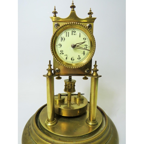 46 - Brass made Anniversary clock with enamel face. No makers mark .  Appears to be in running order. Gla... 