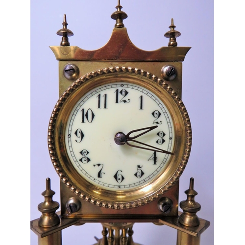 46 - Brass made Anniversary clock with enamel face. No makers mark .  Appears to be in running order. Gla... 