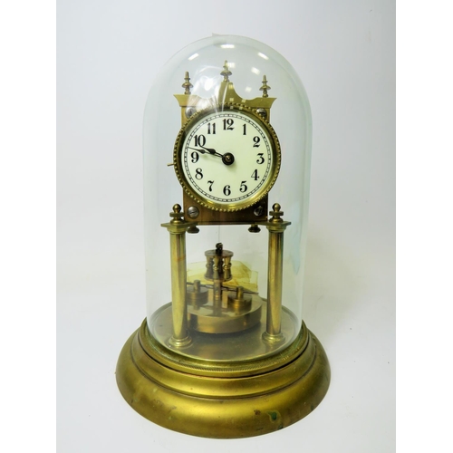 47 - German made brass Anniversary clock under Glass dome. Appears to be in running order.  Small piece m... 