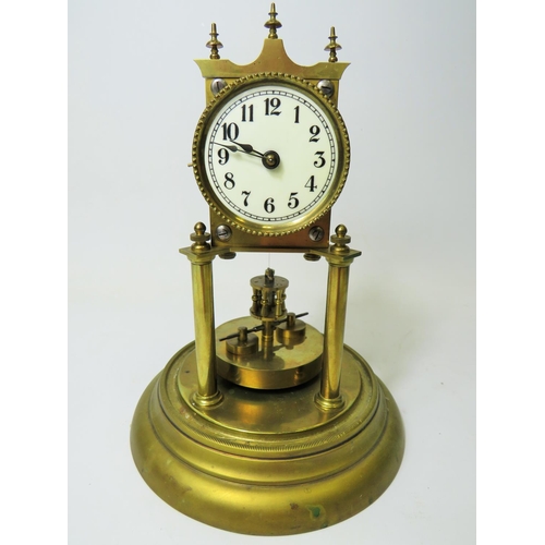 47 - German made brass Anniversary clock under Glass dome. Appears to be in running order.  Small piece m... 