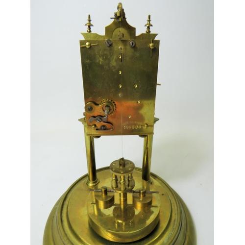 47 - German made brass Anniversary clock under Glass dome. Appears to be in running order.  Small piece m... 