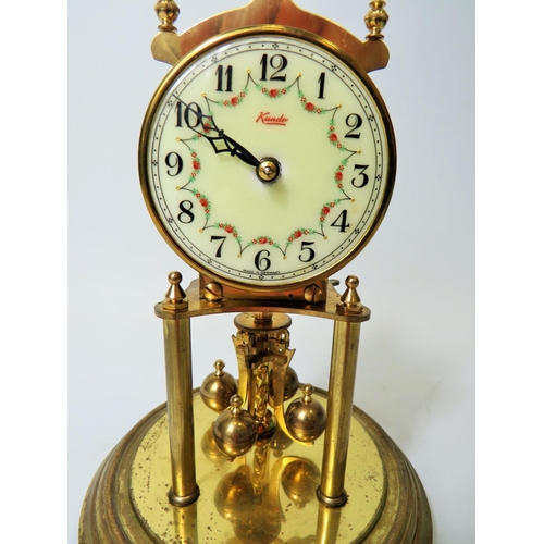 49 - West German Made Kundo Brass based Anniversary Clock. Running order. Adustable height feet. Comes wi... 