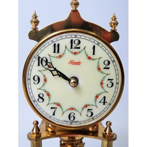 49 - West German Made Kundo Brass based Anniversary Clock. Running order. Adustable height feet. Comes wi... 