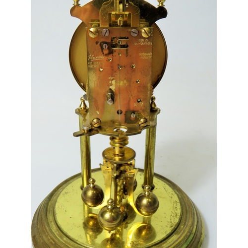 49 - West German Made Kundo Brass based Anniversary Clock. Running order. Adustable height feet. Comes wi... 