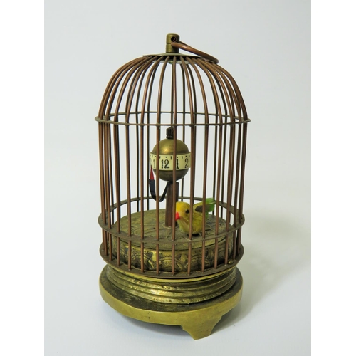 51 - Early 20th Century Gilt metal autonamon clock as a little bird in a cage. Globe hour reader which ro... 