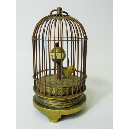 51 - Early 20th Century Gilt metal autonamon clock as a little bird in a cage. Globe hour reader which ro... 