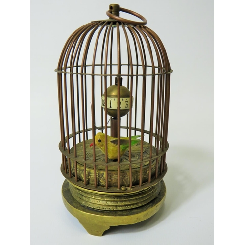 51 - Early 20th Century Gilt metal autonamon clock as a little bird in a cage. Globe hour reader which ro... 