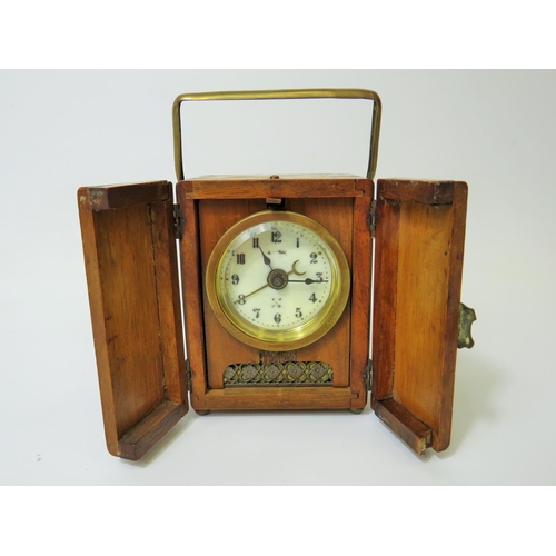 53 - Small German made Carriage Alarm clock in running order. 4 inches tall.   Requires key. See photos.