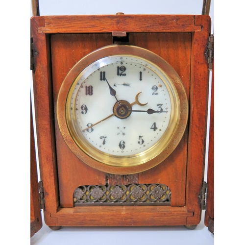 53 - Small German made Carriage Alarm clock in running order. 4 inches tall.   Requires key. See photos.