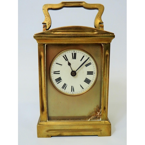 54 - Brass Carriage clock with glass panels and door. Enamel dial. Working order. (small amount of damage... 