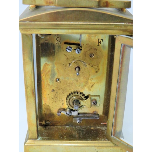 54 - Brass Carriage clock with glass panels and door. Enamel dial. Working order. (small amount of damage... 