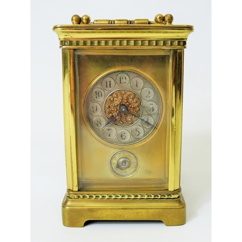 55 - Brass Carriage clock with alarm,  glass panels and door. Enamel dial. Working order.   Requires key.... 