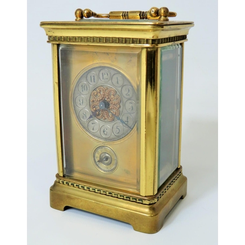 55 - Brass Carriage clock with alarm,  glass panels and door. Enamel dial. Working order.   Requires key.... 