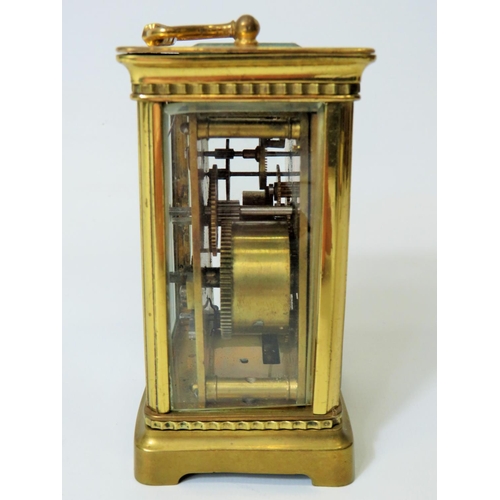 55 - Brass Carriage clock with alarm,  glass panels and door. Enamel dial. Working order.   Requires key.... 