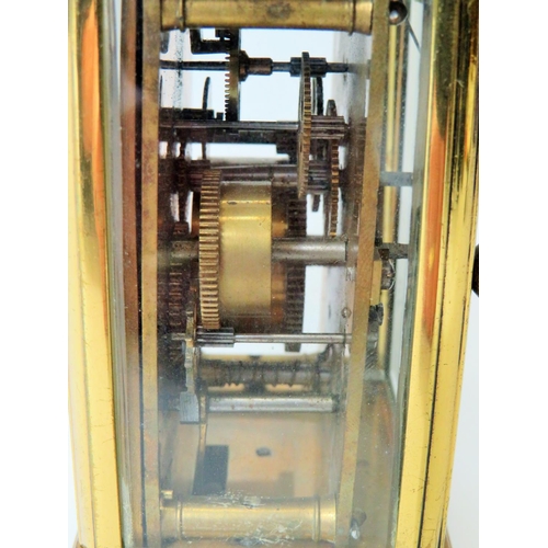 55 - Brass Carriage clock with alarm,  glass panels and door. Enamel dial. Working order.   Requires key.... 