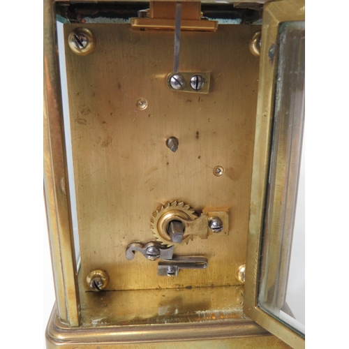 56 - Brass Carriage Clock with enamel face. Glass panels and door.  Running order, requires key.  5 inche... 