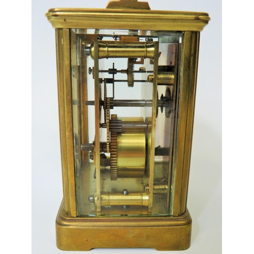 56 - Brass Carriage Clock with enamel face. Glass panels and door.  Running order, requires key.  5 inche... 