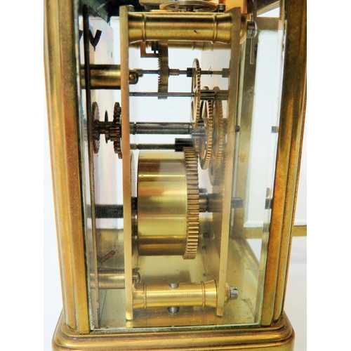 56 - Brass Carriage Clock with enamel face. Glass panels and door.  Running order, requires key.  5 inche... 