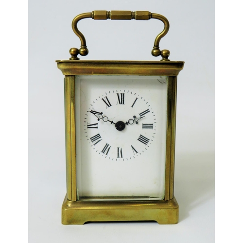 57 - Brass Carriage Clock with enamel face. Glass panels and door. Makers or Retailers mark of ACC  Runni... 