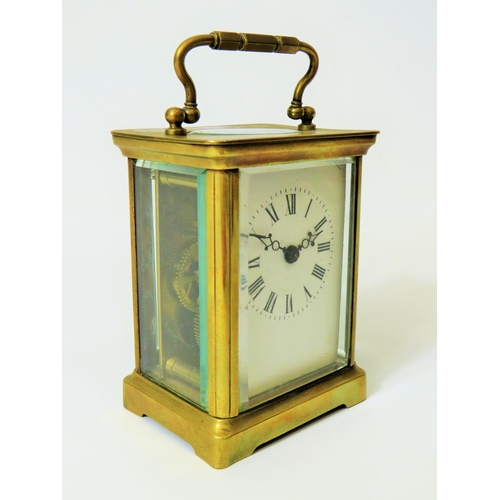 57 - Brass Carriage Clock with enamel face. Glass panels and door. Makers or Retailers mark of ACC  Runni... 