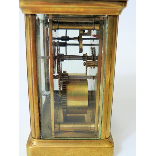 57 - Brass Carriage Clock with enamel face. Glass panels and door. Makers or Retailers mark of ACC  Runni... 