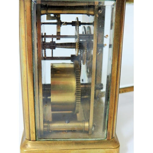 57 - Brass Carriage Clock with enamel face. Glass panels and door. Makers or Retailers mark of ACC  Runni... 