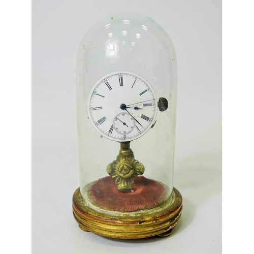 60 - Unusual enamel faced Pocket watch which has been mounted on a brass and wooden stand and under a gla... 