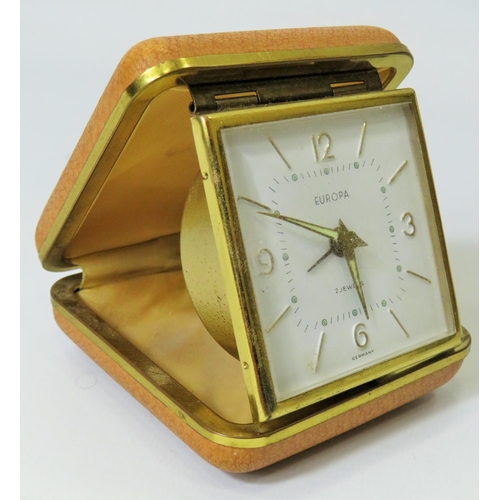 62 - German Made 2 Jewel Europa Travelling alarm clock in working order. See photos.