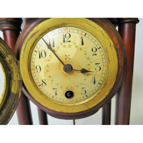 63 - Matched pair of mantle clocks with Mahogany cases and exposed pendulums.  Bun feet with Acorn final ... 