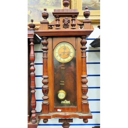 67 - Oak Wall clock in running order wih Key Enamel and brass pendulum with impressed image of a butterfl... 