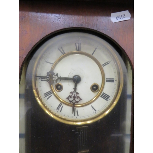 69 - Oak Cased Wall Clock with enamel dial in working order.  38 inches long. See photos.