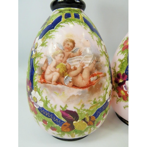 99 - Pair of Milk Glass Vases which have transfer print and hand applied decoration showing cherubs.  Eac... 