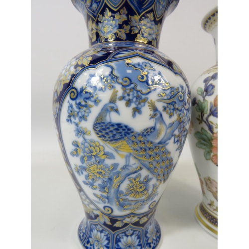 102 - 2 Kaiser German Porcelain vases 22cm tall in the Duchesse and Etude patterns.