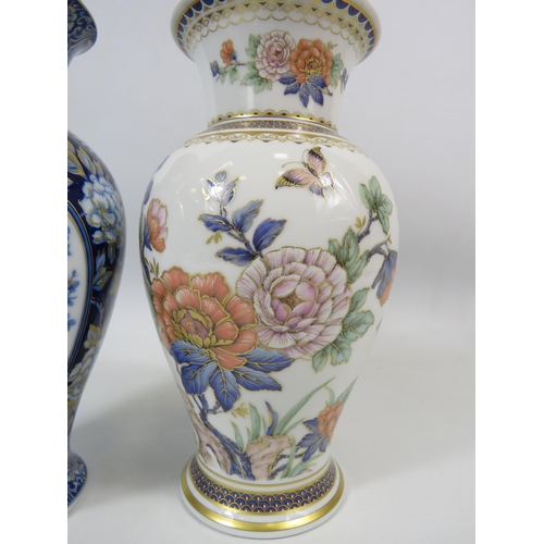 102 - 2 Kaiser German Porcelain vases 22cm tall in the Duchesse and Etude patterns.