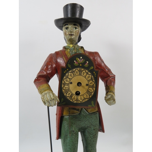 116 - Novelty cast iron peddler clock in the form of a dandy dressed man,repair to neck and for spares or ... 