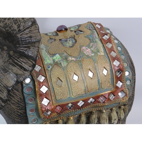 119 - Large resin elephant sculpture decorated with mirrors, jewels and mother of pearl, it stands approx ... 