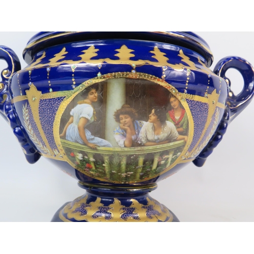 124 - Large Royal Limoge blue and gold twin handle lidded urn vase with panels dipicting girls on a balcon... 