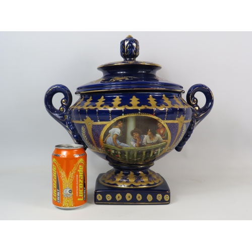 124 - Large Royal Limoge blue and gold twin handle lidded urn vase with panels dipicting girls on a balcon... 