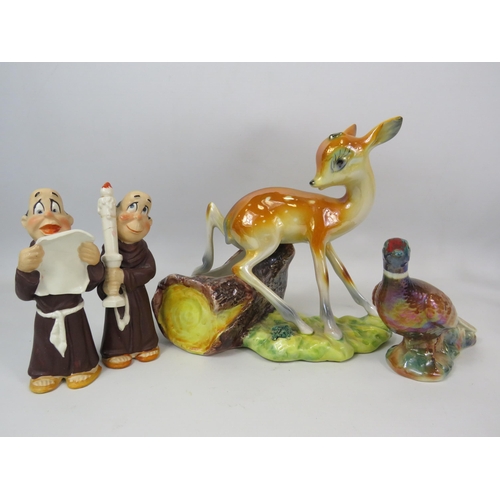 306 - Kitch ceramic figurines including a large lustre Deer, one monk has had a repair to the candle.