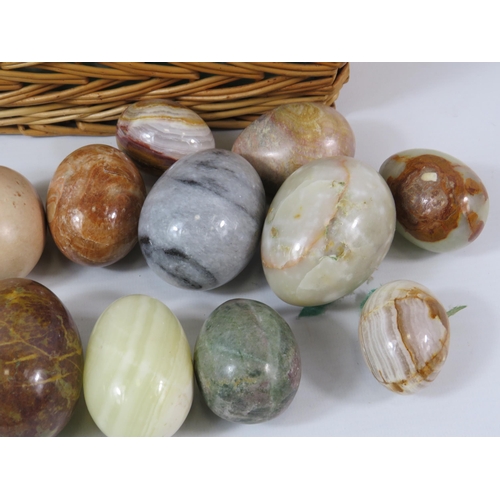 309 - Basket with 15 polished stone and onyx eggs.