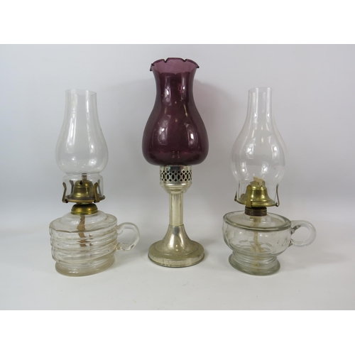 310 - 2 Vintage glass chamber oil lamps plus a candlestick lamp.